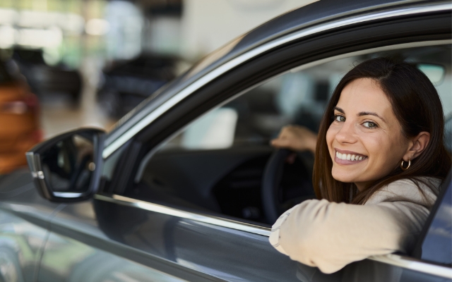Girl sitting in new car